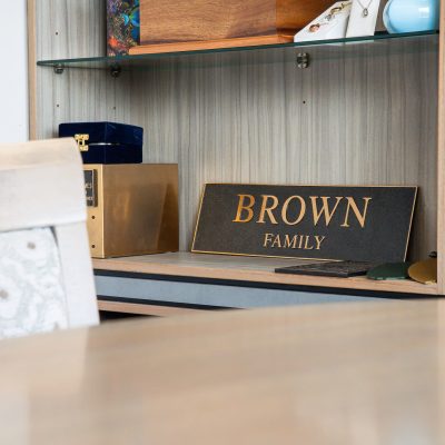 Brown family plaque sitting on a desk at the funeral home